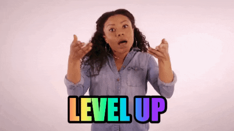 Woman gesturing excitedly beneath rainbow 'LEVEL UP' text
