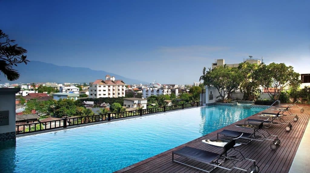 Marriott rooftop infinity pool and wooden loungers overlooking Chiang Mai and Doi Suthep