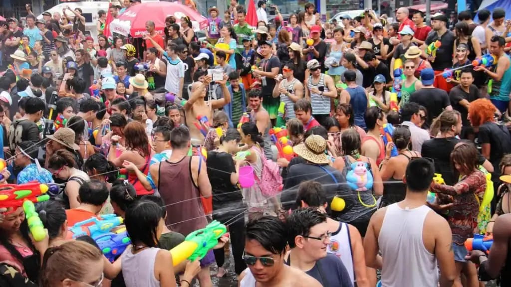 Crowd of revelers with water guns during the Songkran water festival street party in Chiang Mai