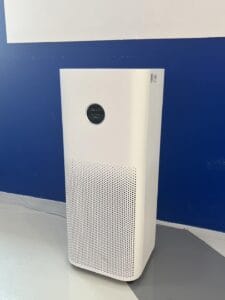 White standing air purifier against a blue and white wall at Little Soul Kids Planet