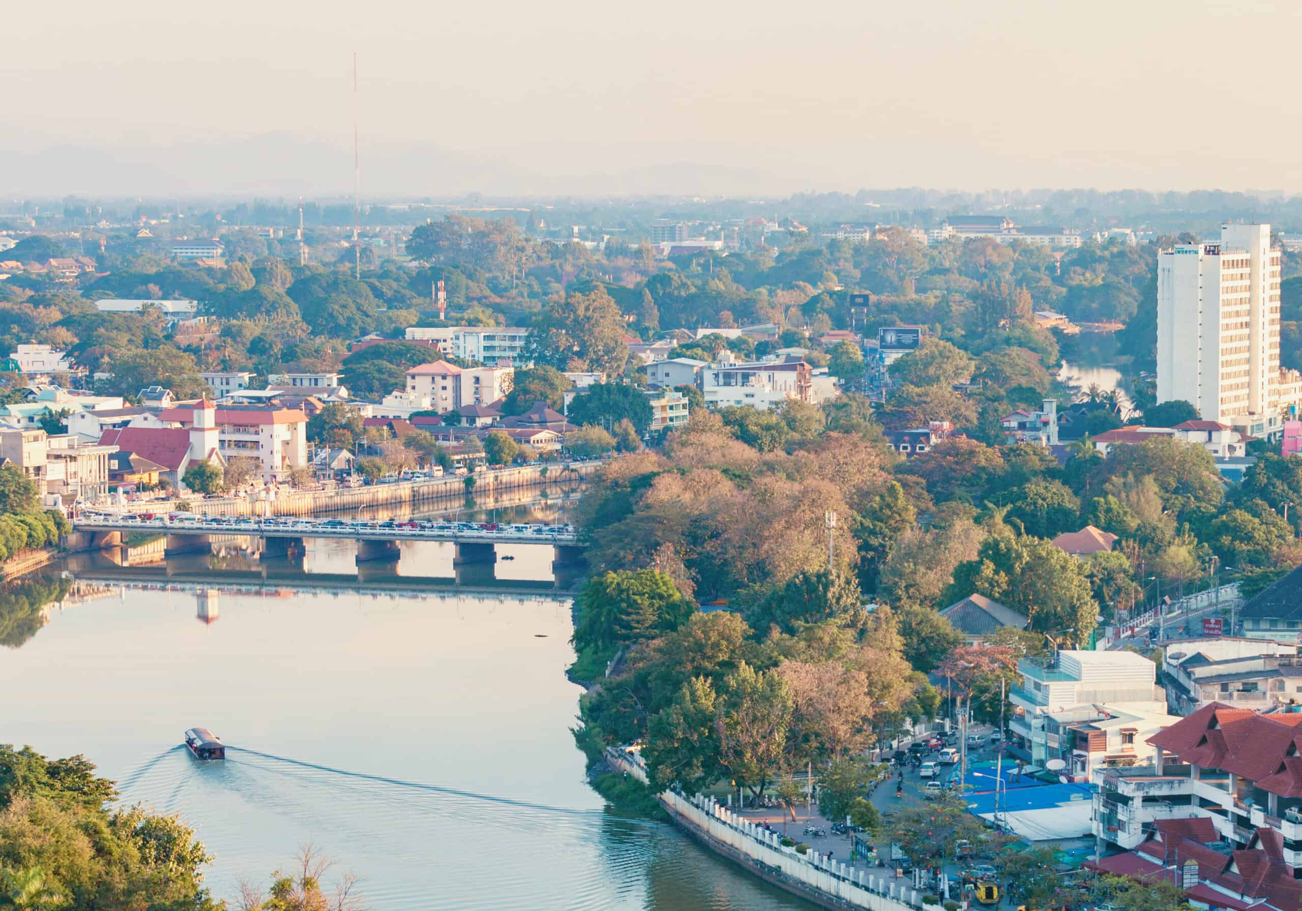 Aerial view of Chiang Mai's riverside neighborhoods along the Ping River
